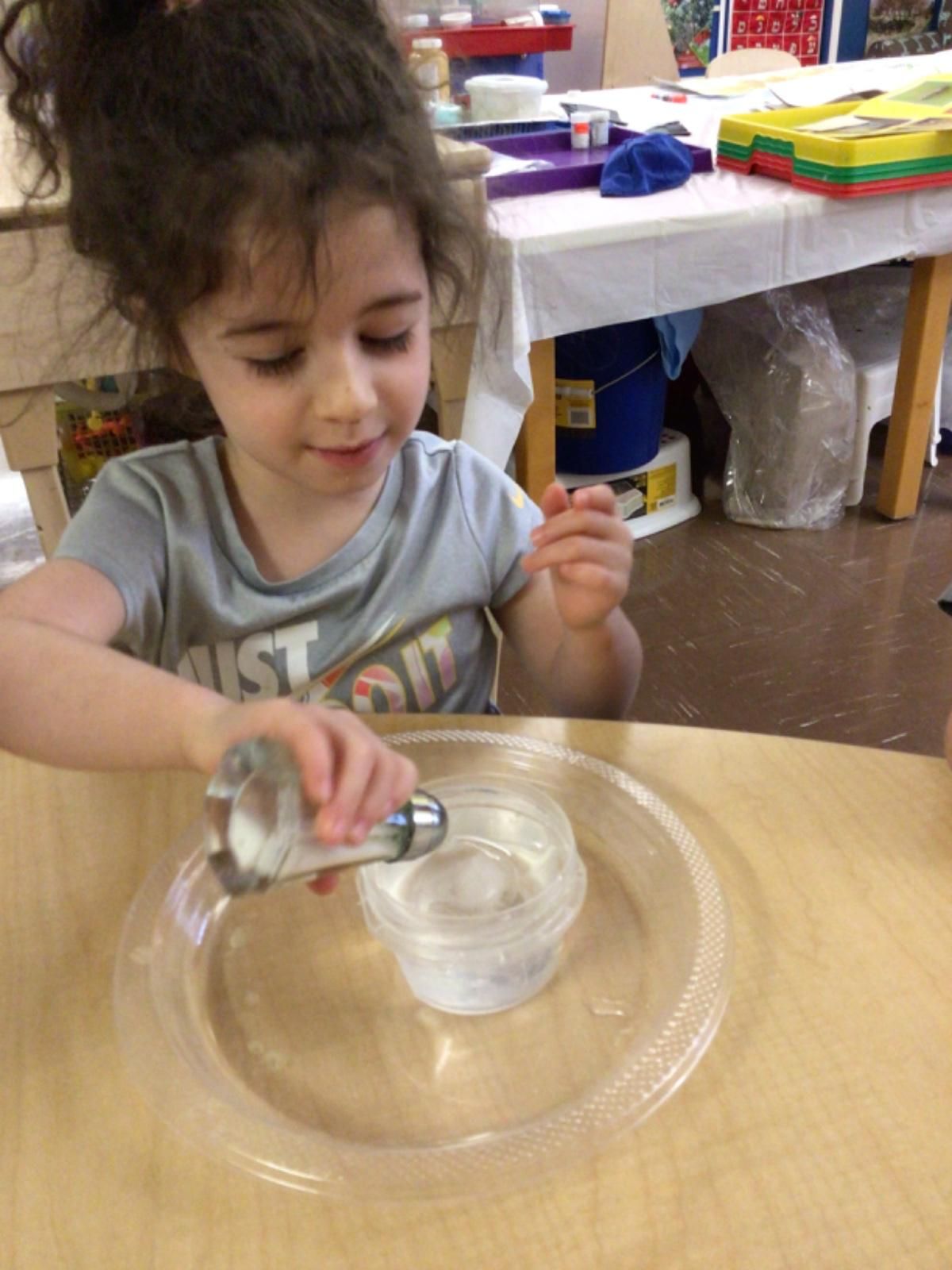 A little girl doing a craft