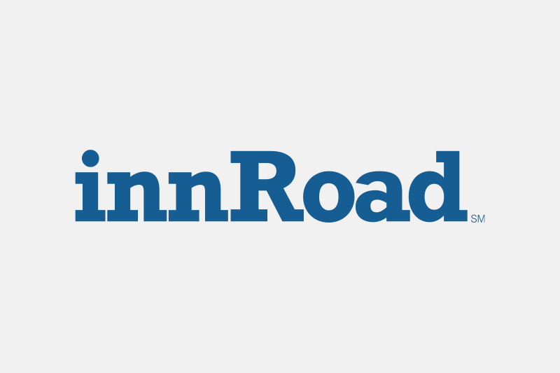 The inn road logo is blue and white on a white background.