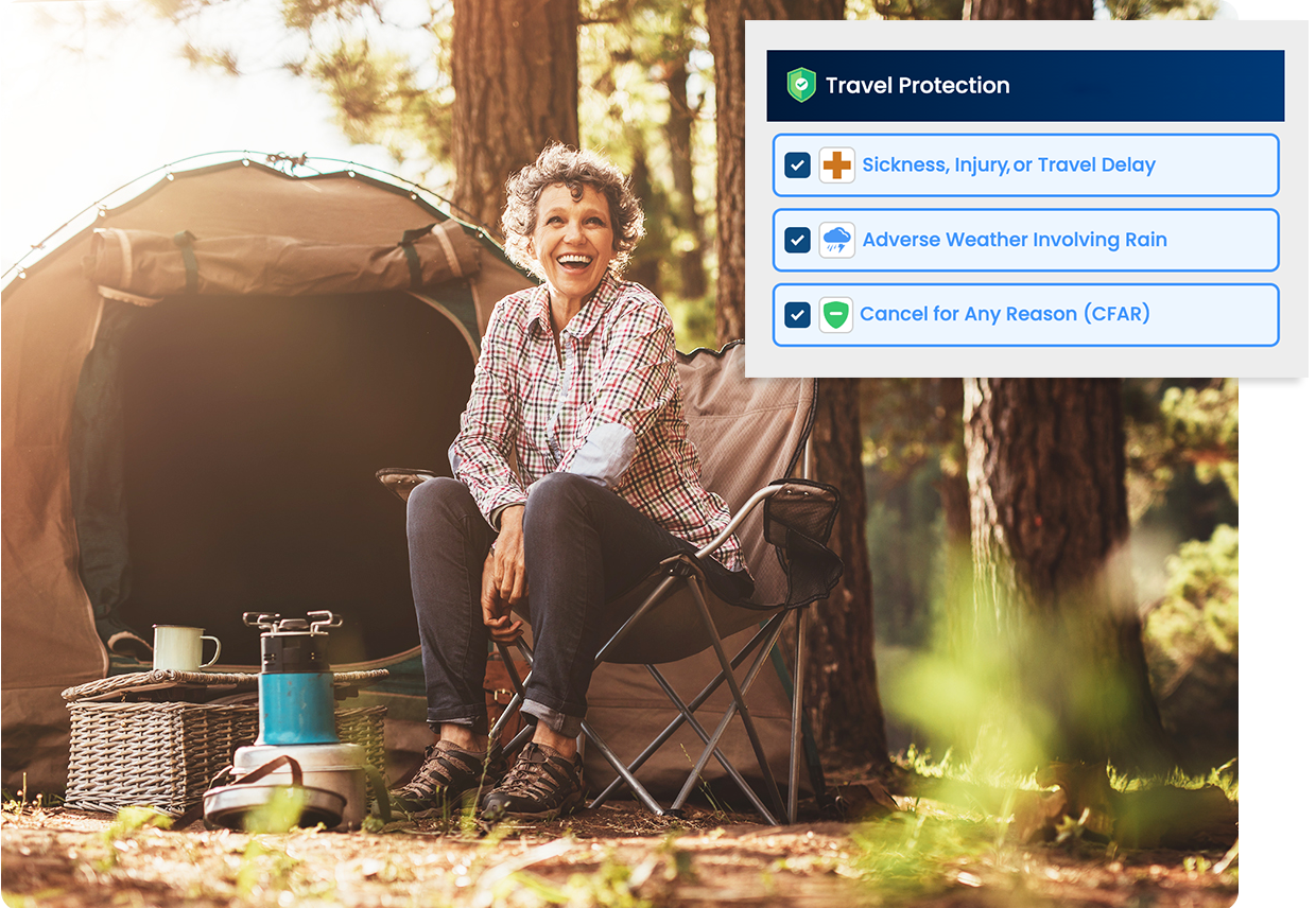 A woman is sitting in a chair in front of a tent in the woods.