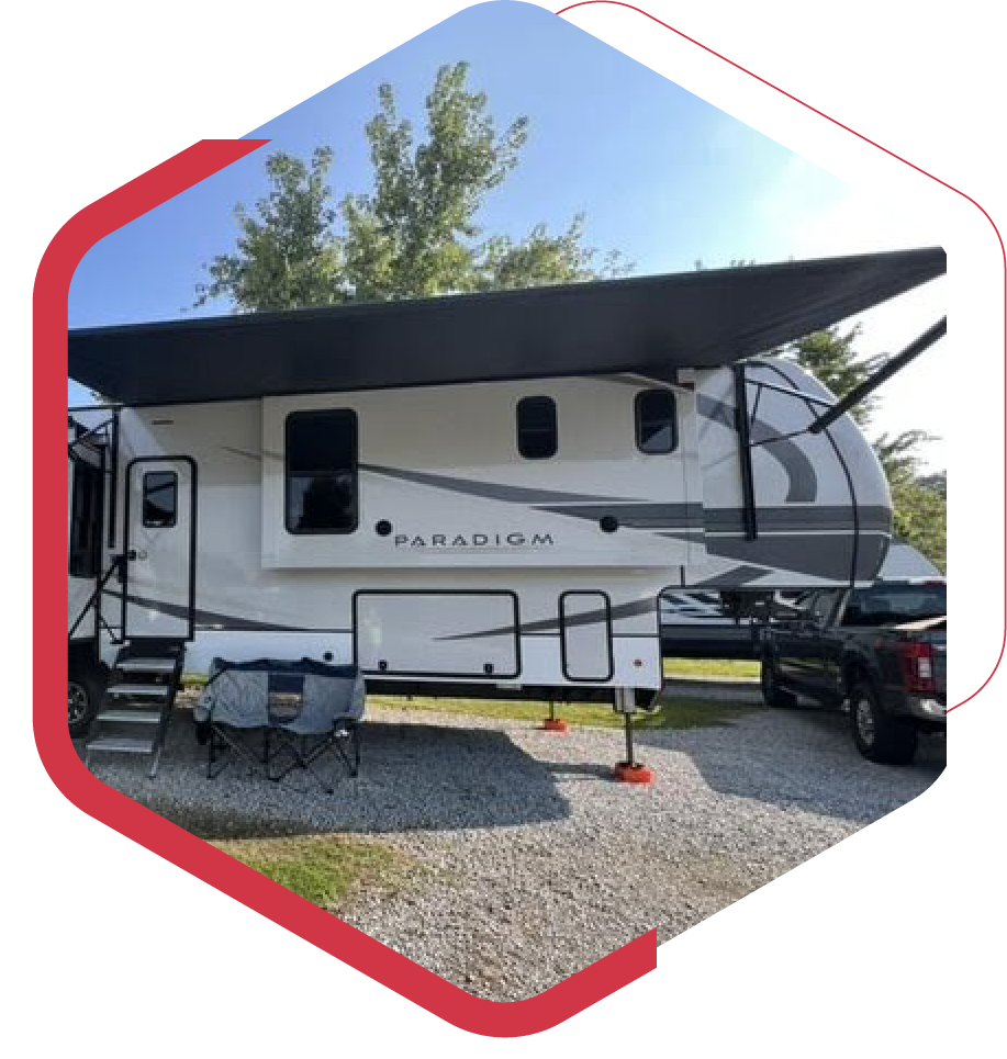 A white rv with the word paradox on the side