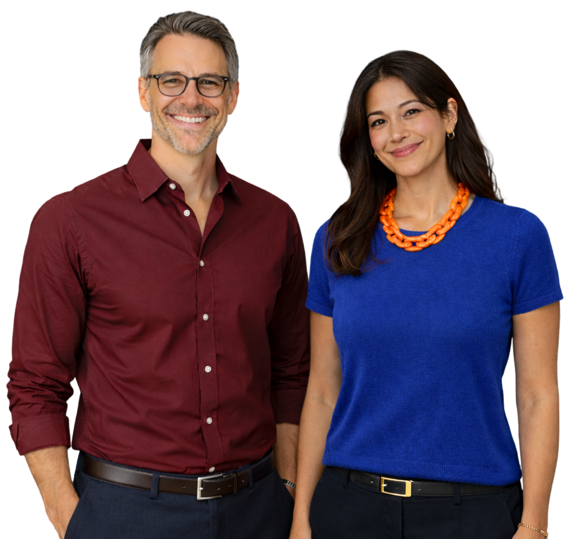 Man in orange shirt and glasses smiling, hands in pockets.