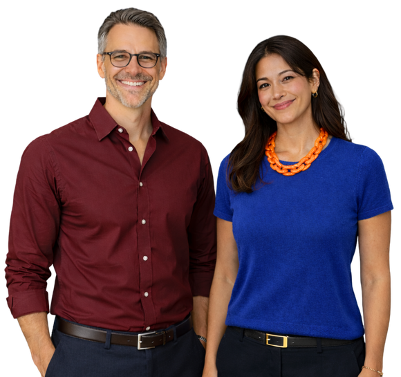 Man in orange shirt and glasses smiling, hands in pockets.