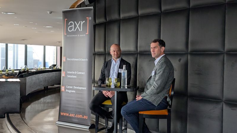 Two men seated for a discussion near an