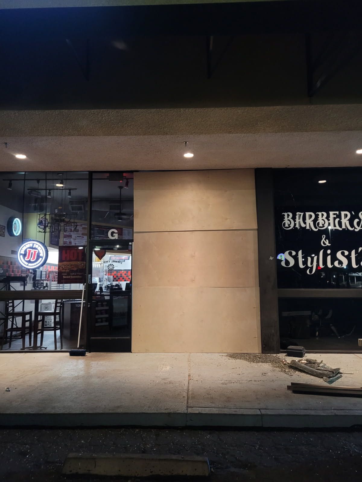 A barber shop with a sign that says barber & stylist