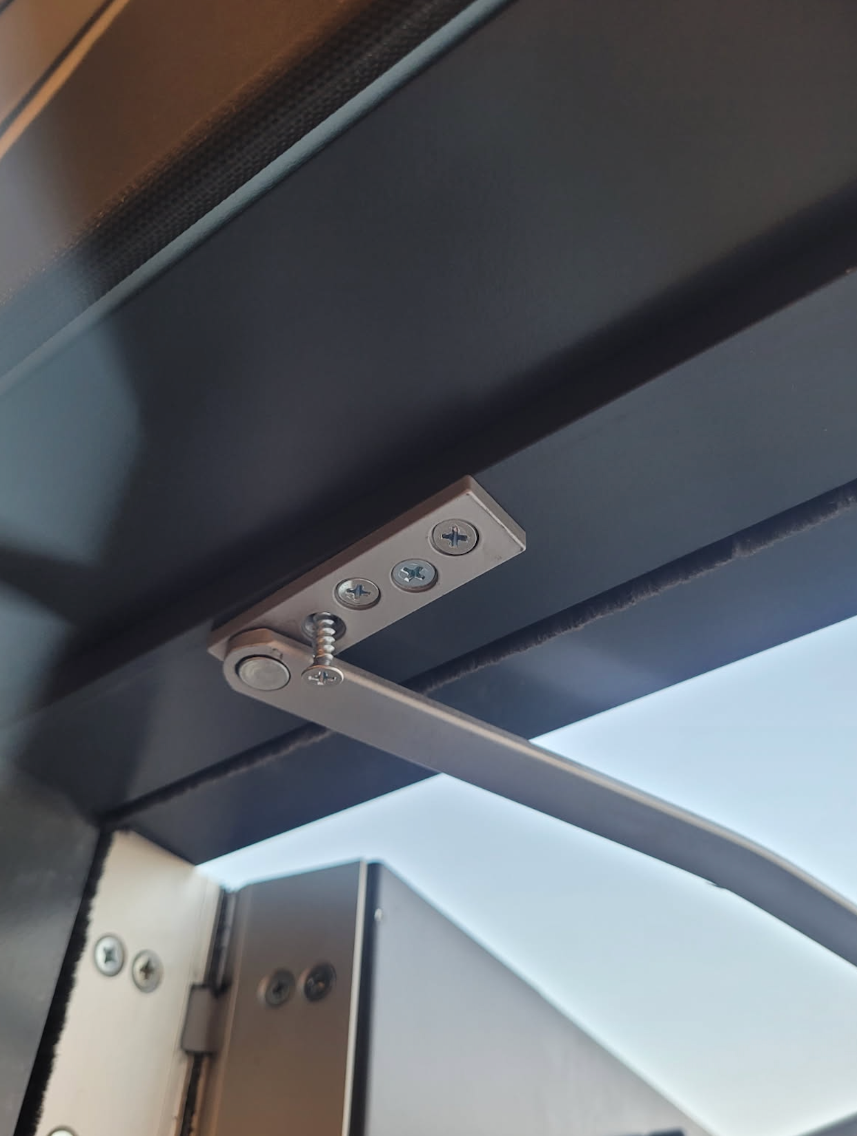 A close up of a door with a screw on it