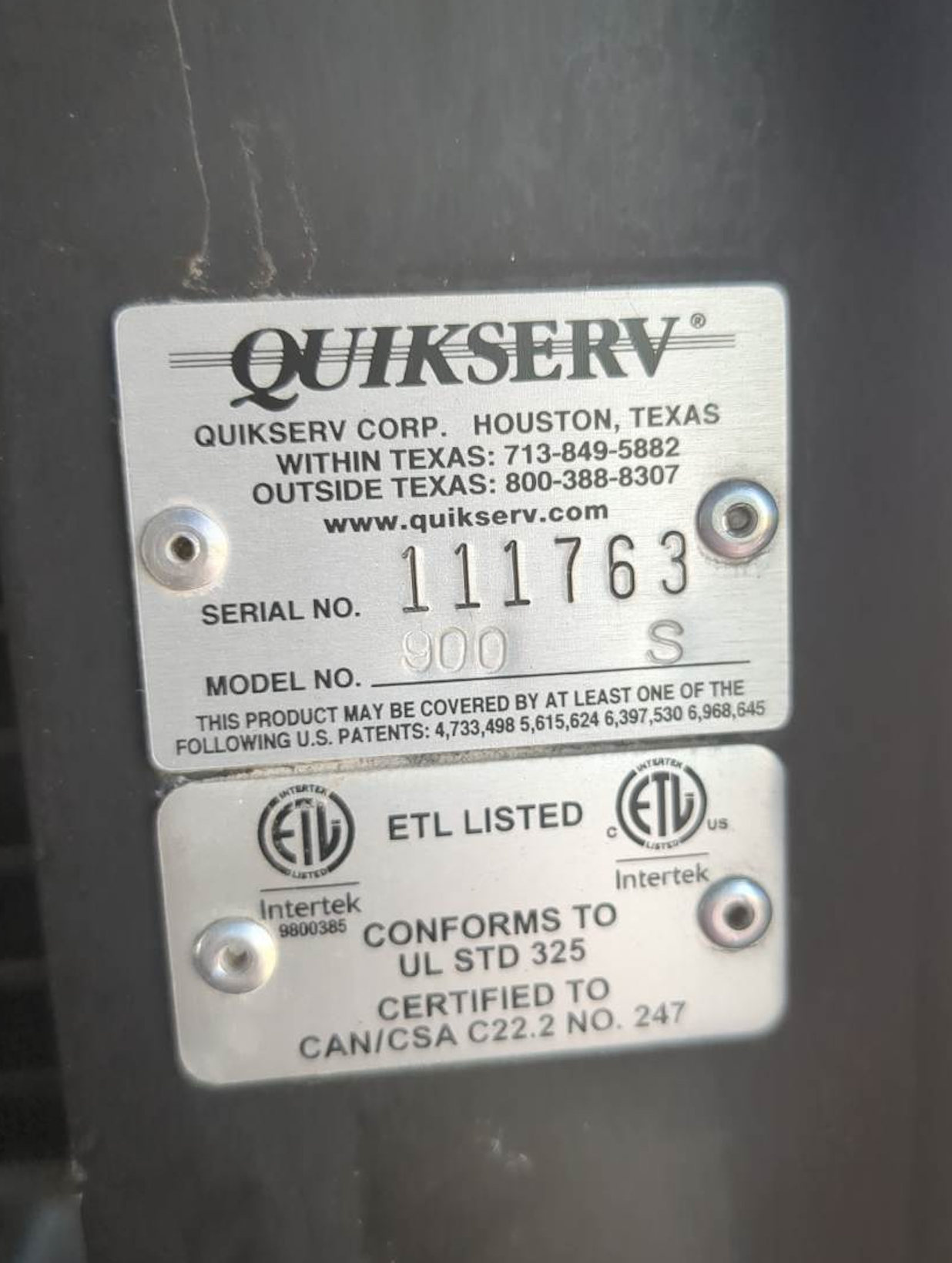 A quikserv label that says serial number 111763 on it