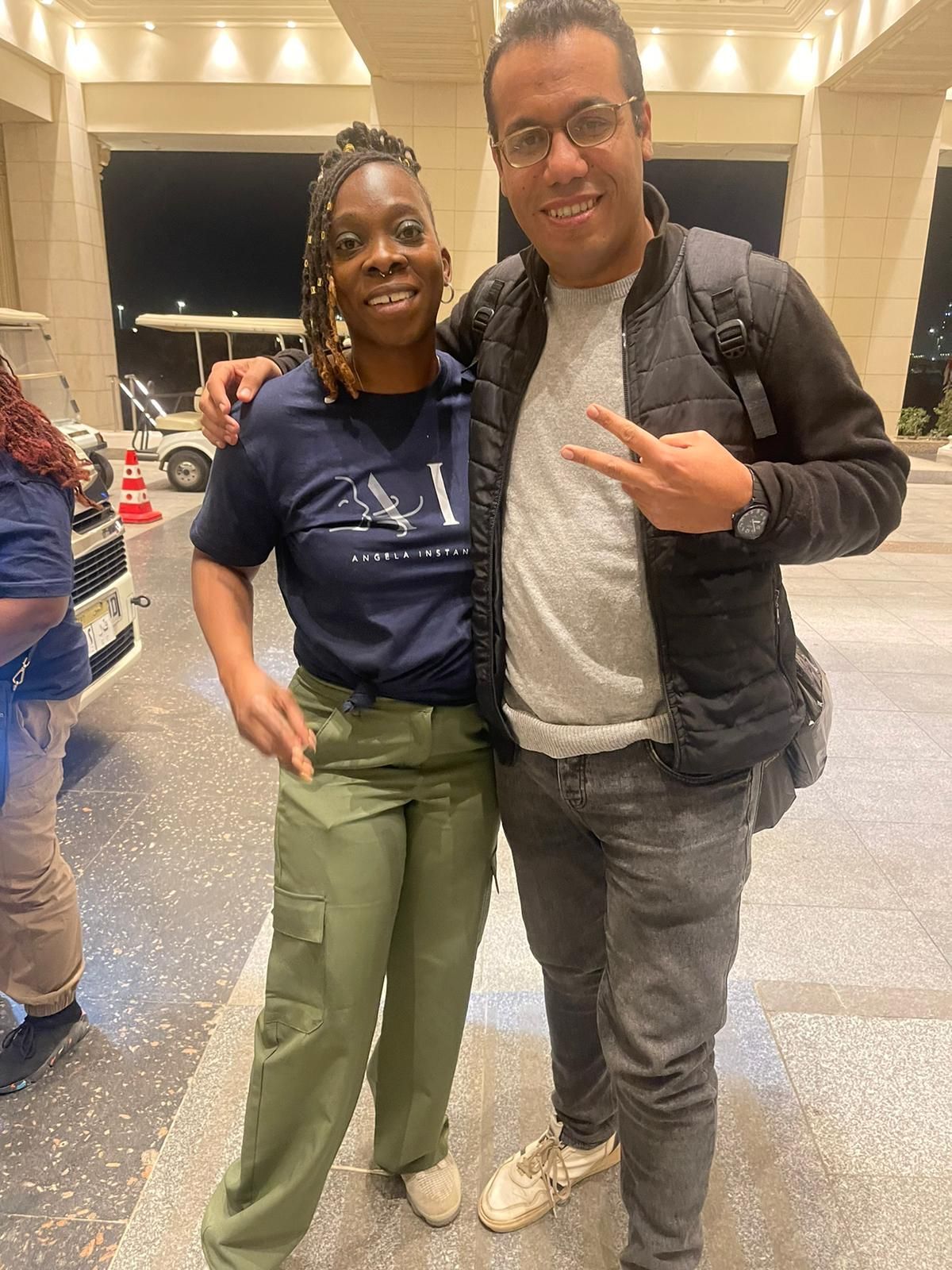 A man and a woman are posing for a picture together.