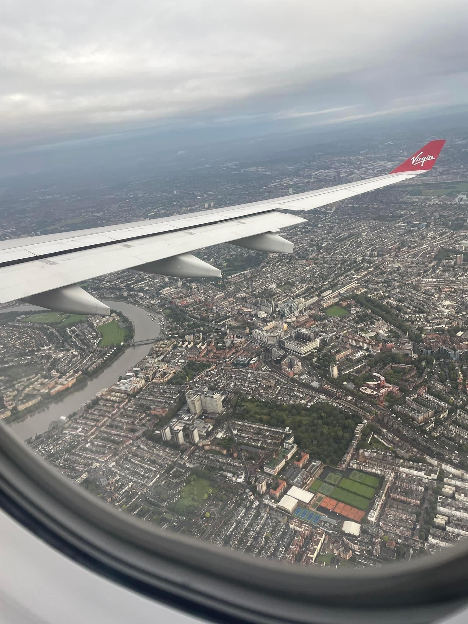 An aerial view of a city from an airplane window.