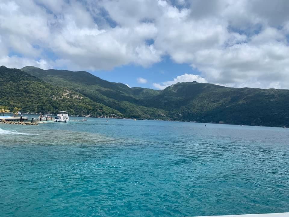 A large body of water with mountains in the background.