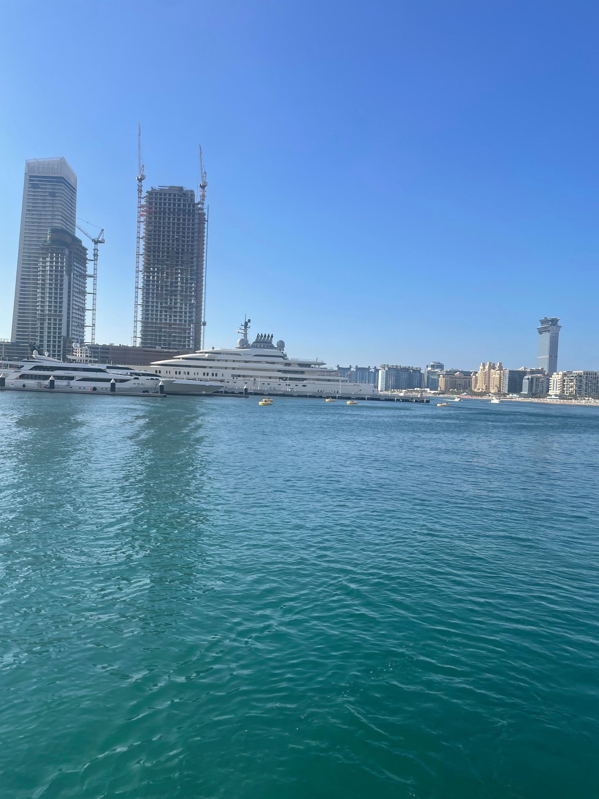 A large body of water with a city in the background
