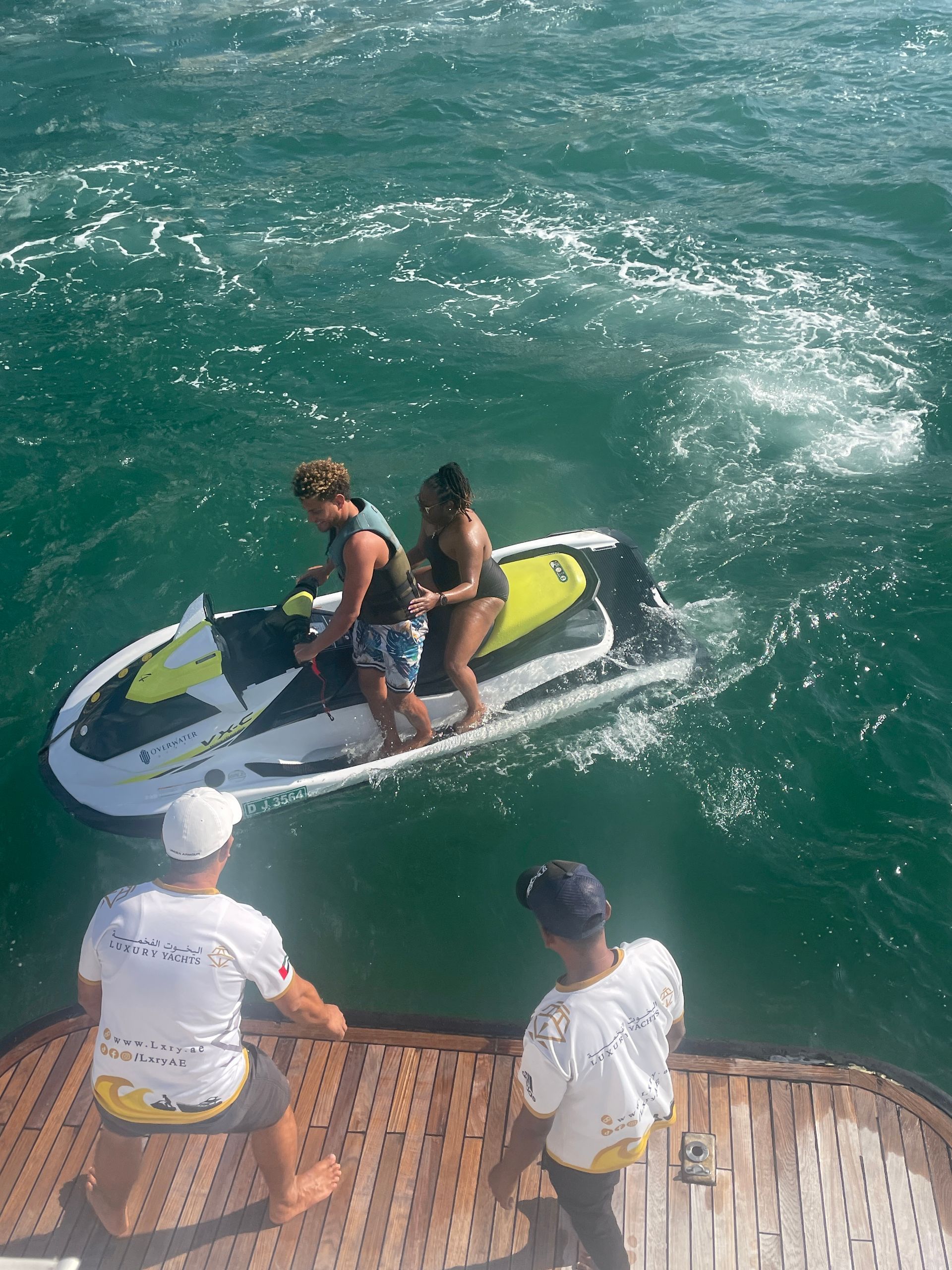 A group of people are riding a jet ski in the ocean.
