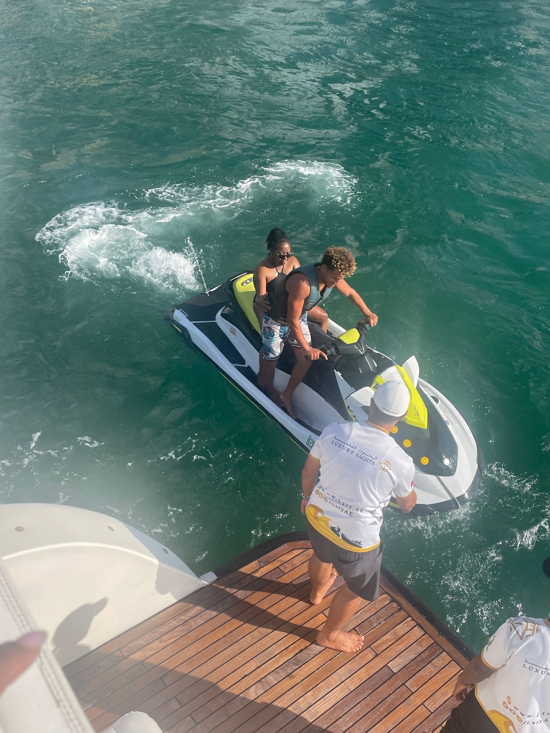 A group of people are riding a jet ski in the ocean.