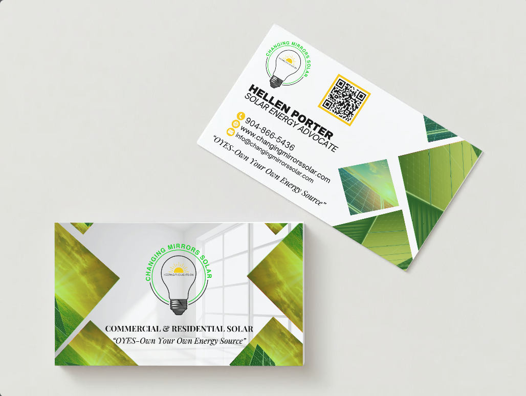 A business card with a light bulb on it is sitting on a table.