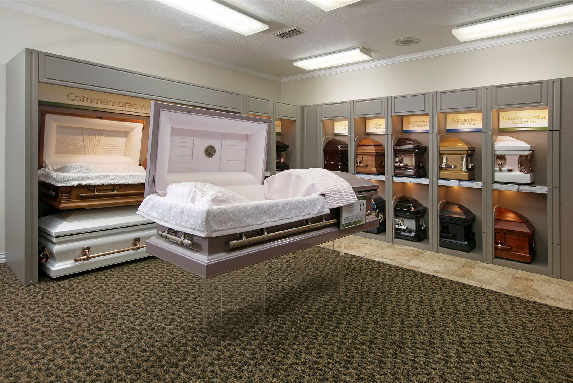 A room filled with lots of coffins and a coffin hanging from the ceiling.