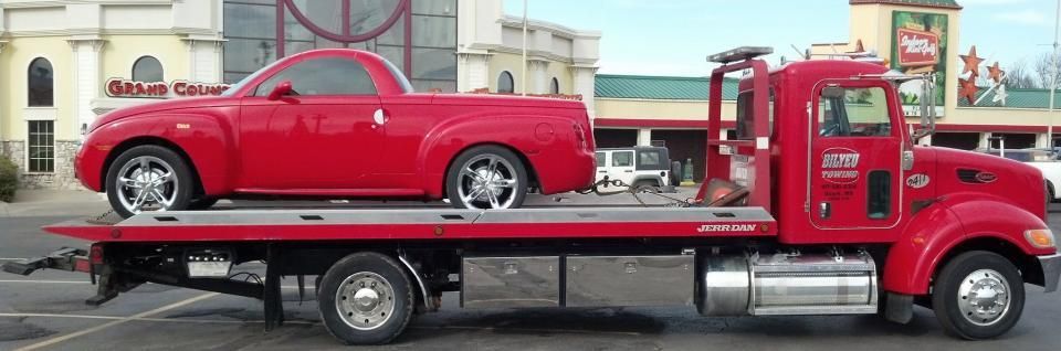 red car being towed