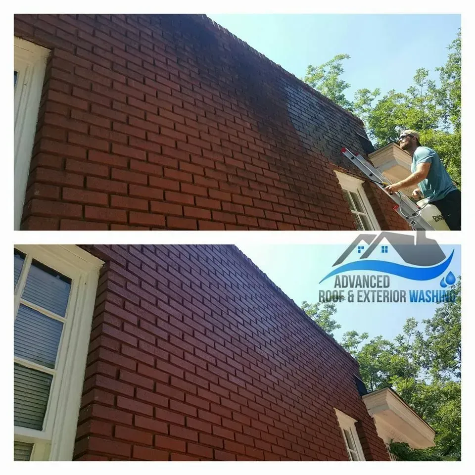 Before and after photos of a brick wall being cleaned. Man on ladder power washes the building.