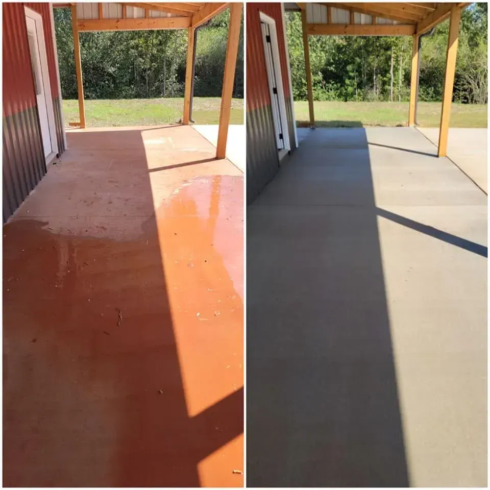 Comparison of a red-toned concrete patio before and after, now smooth gray. Under a wood-beamed shelter.