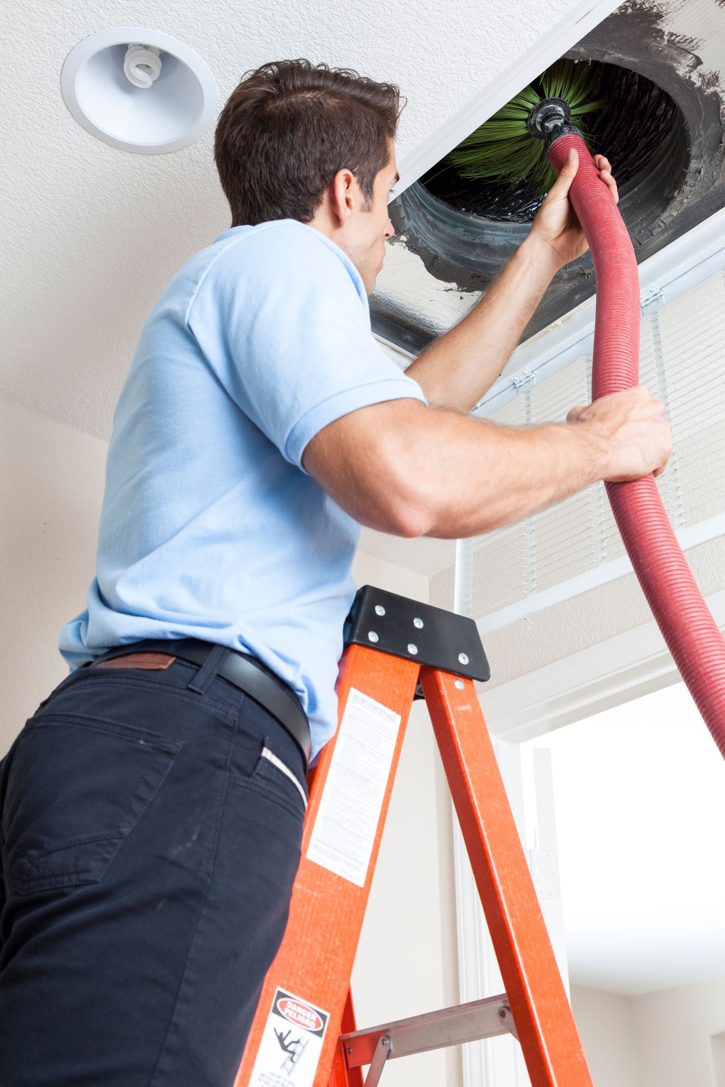 Technician from Pro Sweep Chimney Service doing a Professional Chimney Cleaning in London, OH