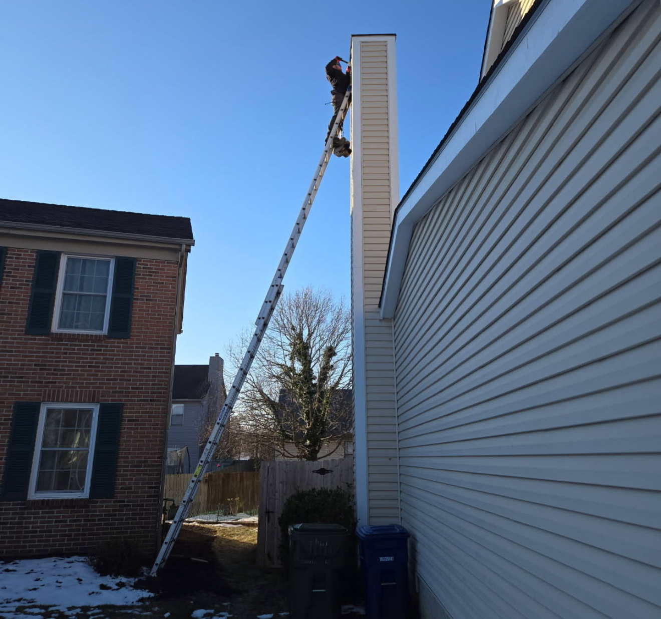 Man Inspecting The Chimney — Columbus, OH — Pro Sweep Chimney