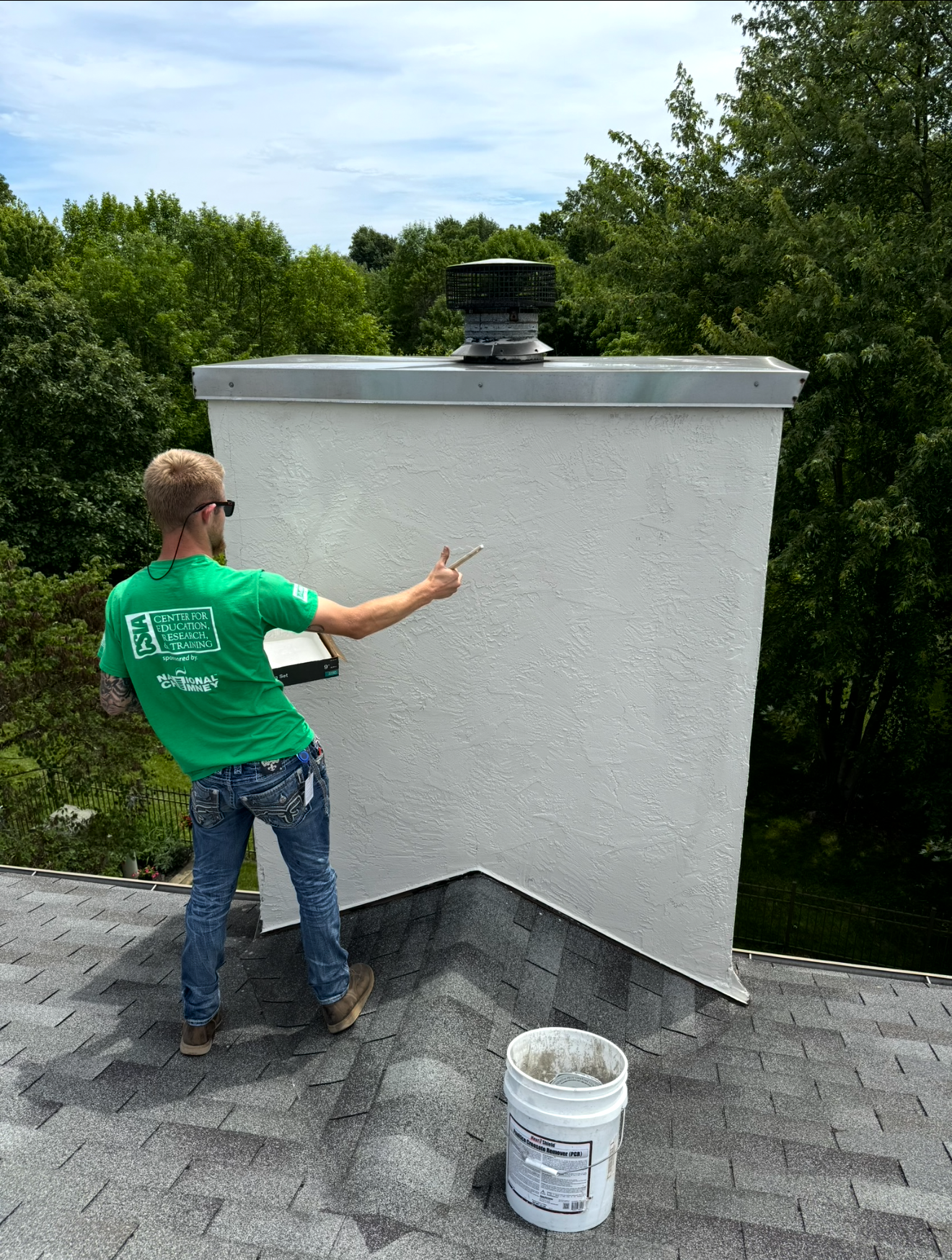 Man On The Roof Sweeping Chimney — Columbus, OH — Pro Sweep Chimney