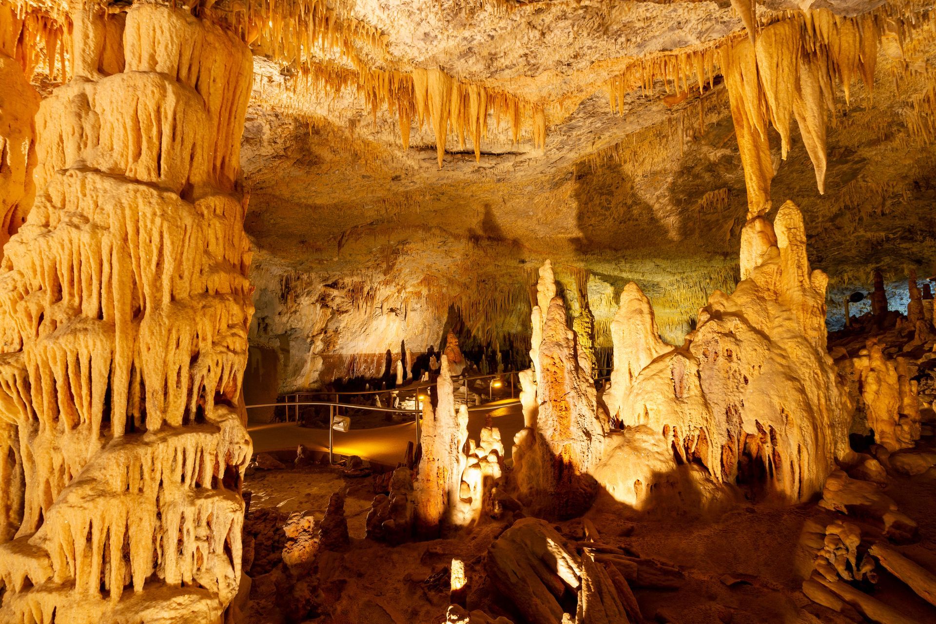 A large cave filled with stalactites and stalagmites