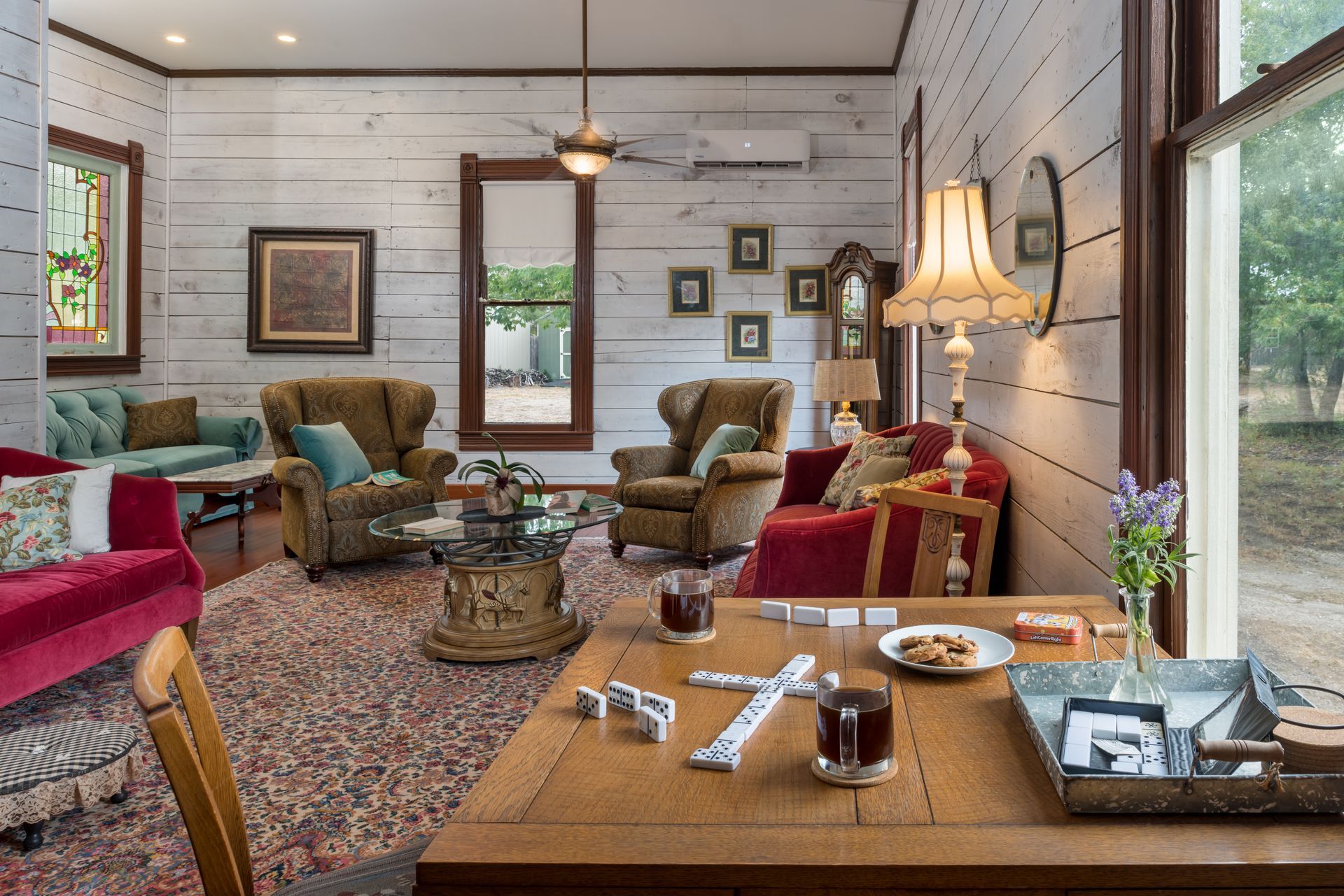 A living room with furniture and a table with dominoes on it.
