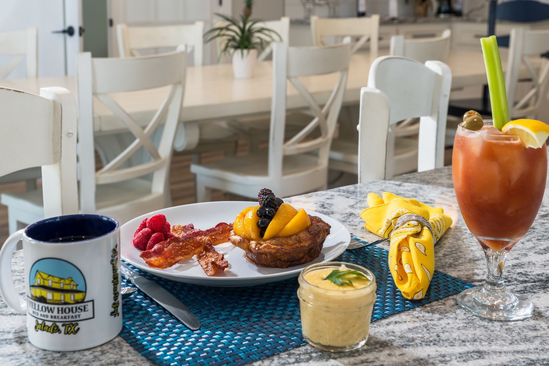 A table topped with a plate of food and a drink.