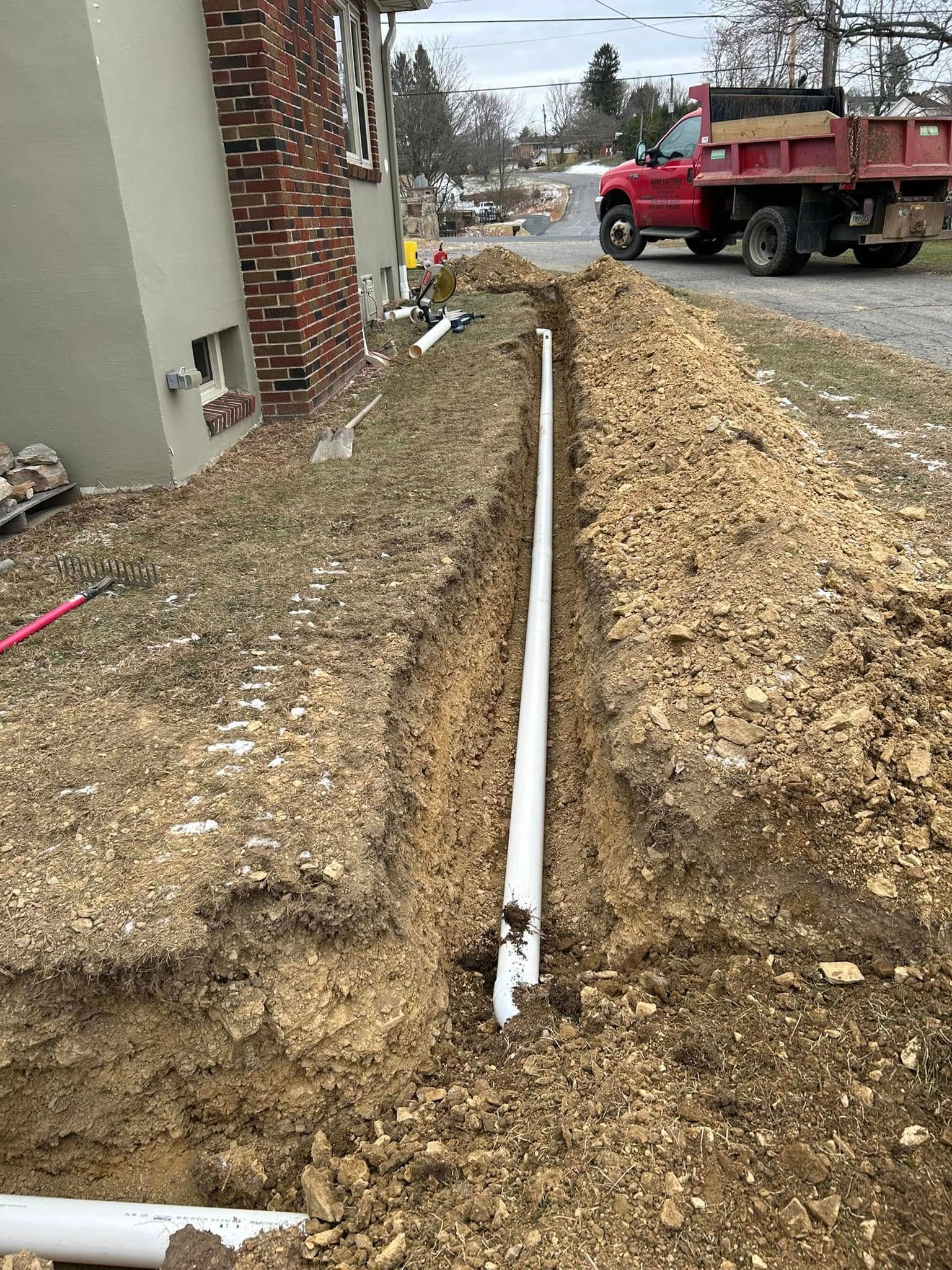 Excavated trench along residential foundation