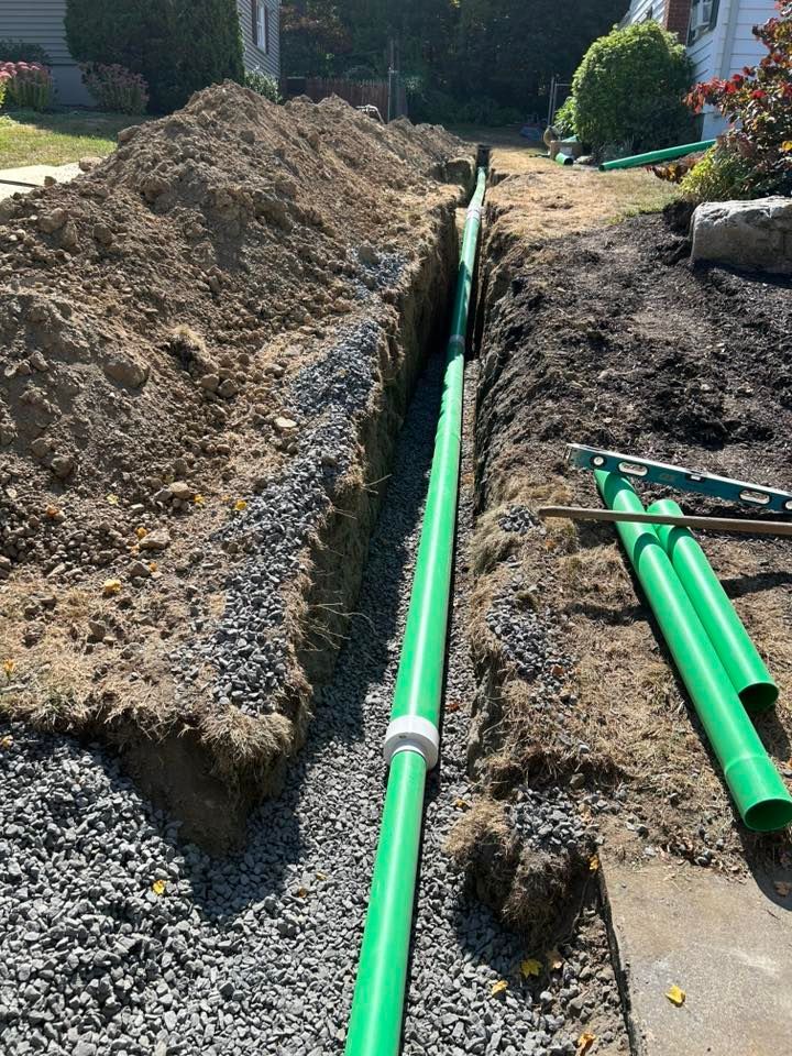 Excavated trench with drainage pipe installation
