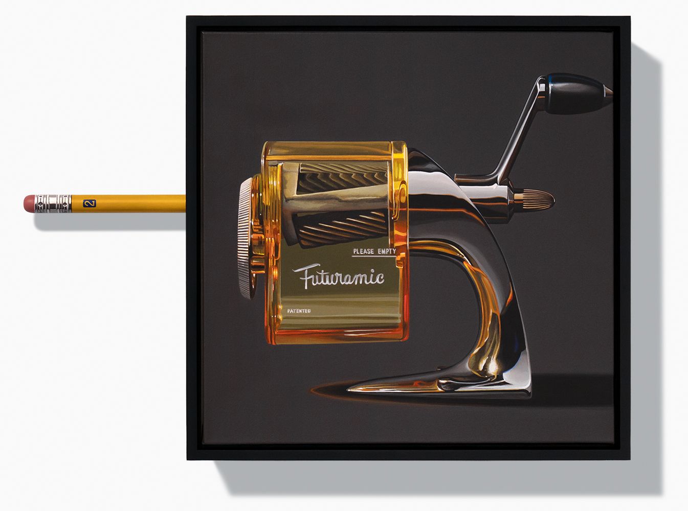 inquire for availability Chrome and translucent yellow pencil sharpener on dark grey background with handmade pencil mounted to picture frame.