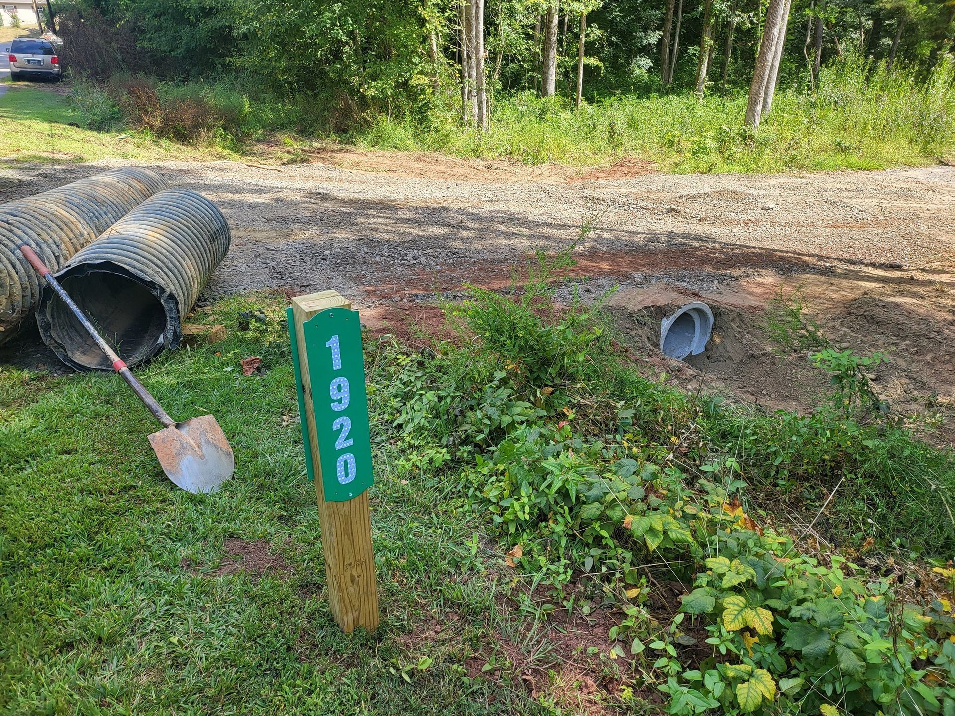Green yard sign marked 
