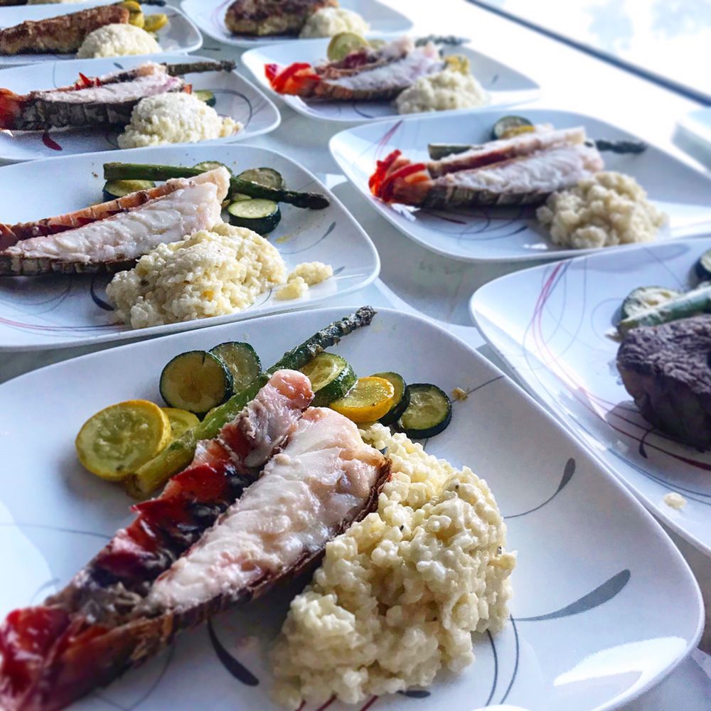 A row of plates filled with different types of food