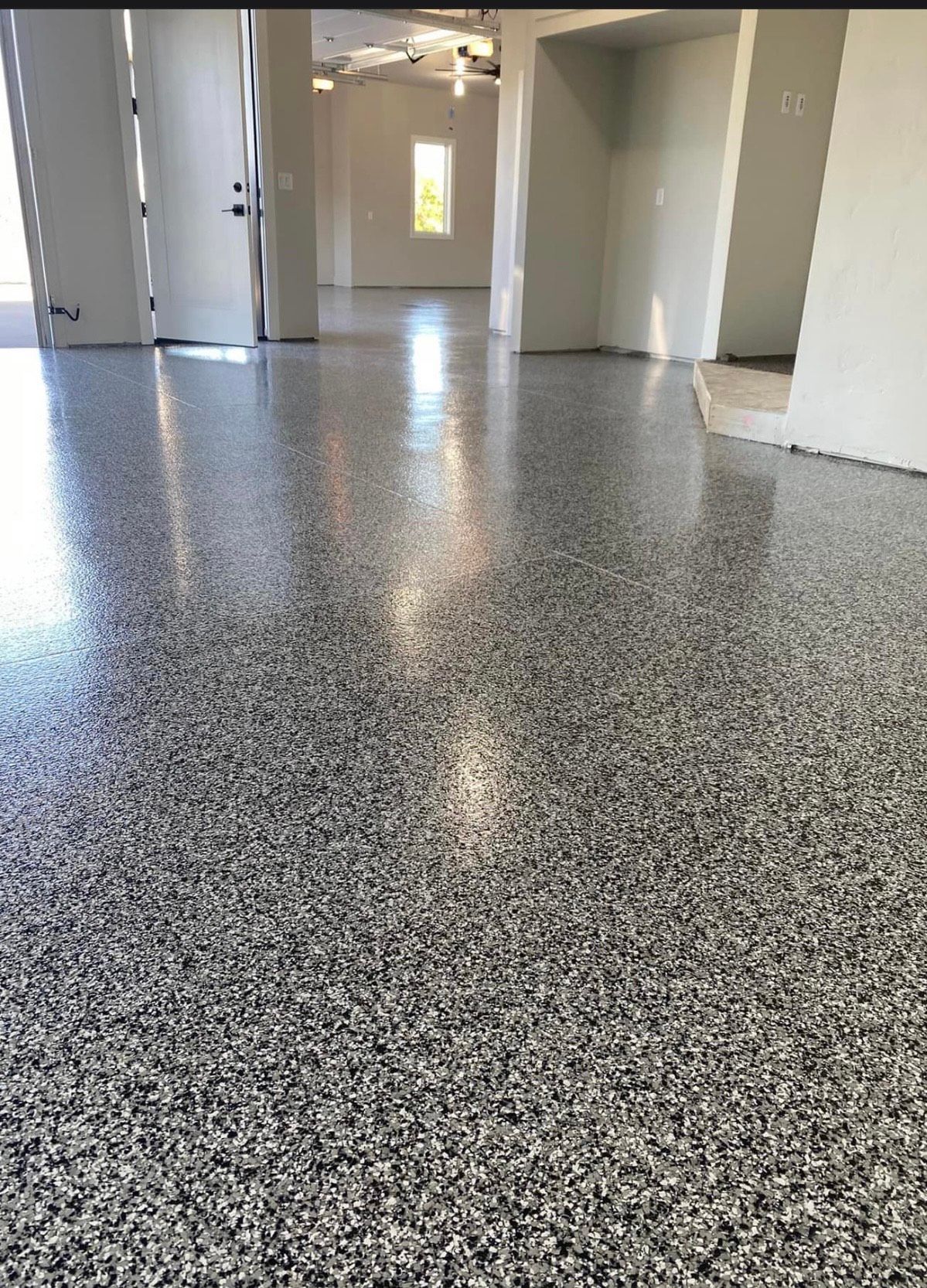 A garage floor with a lot of small stones on it.