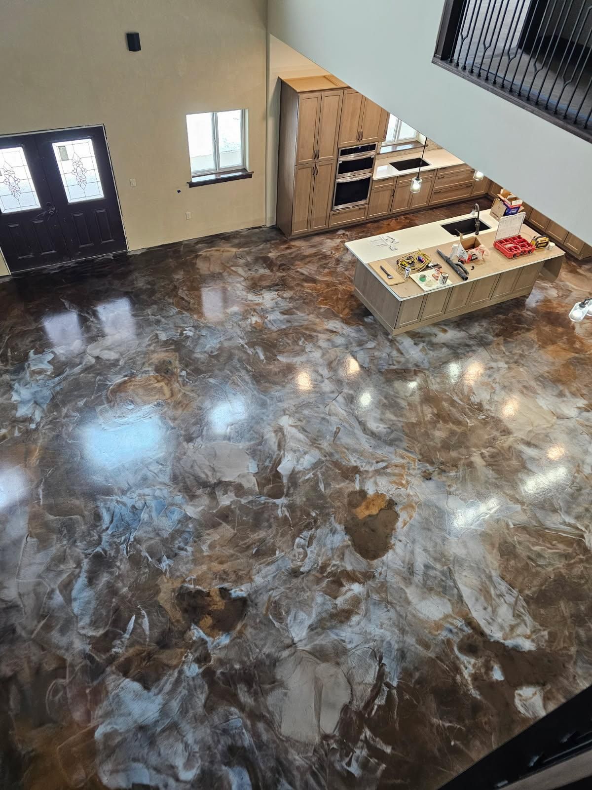 An aerial view of a kitchen with a marble floor.
