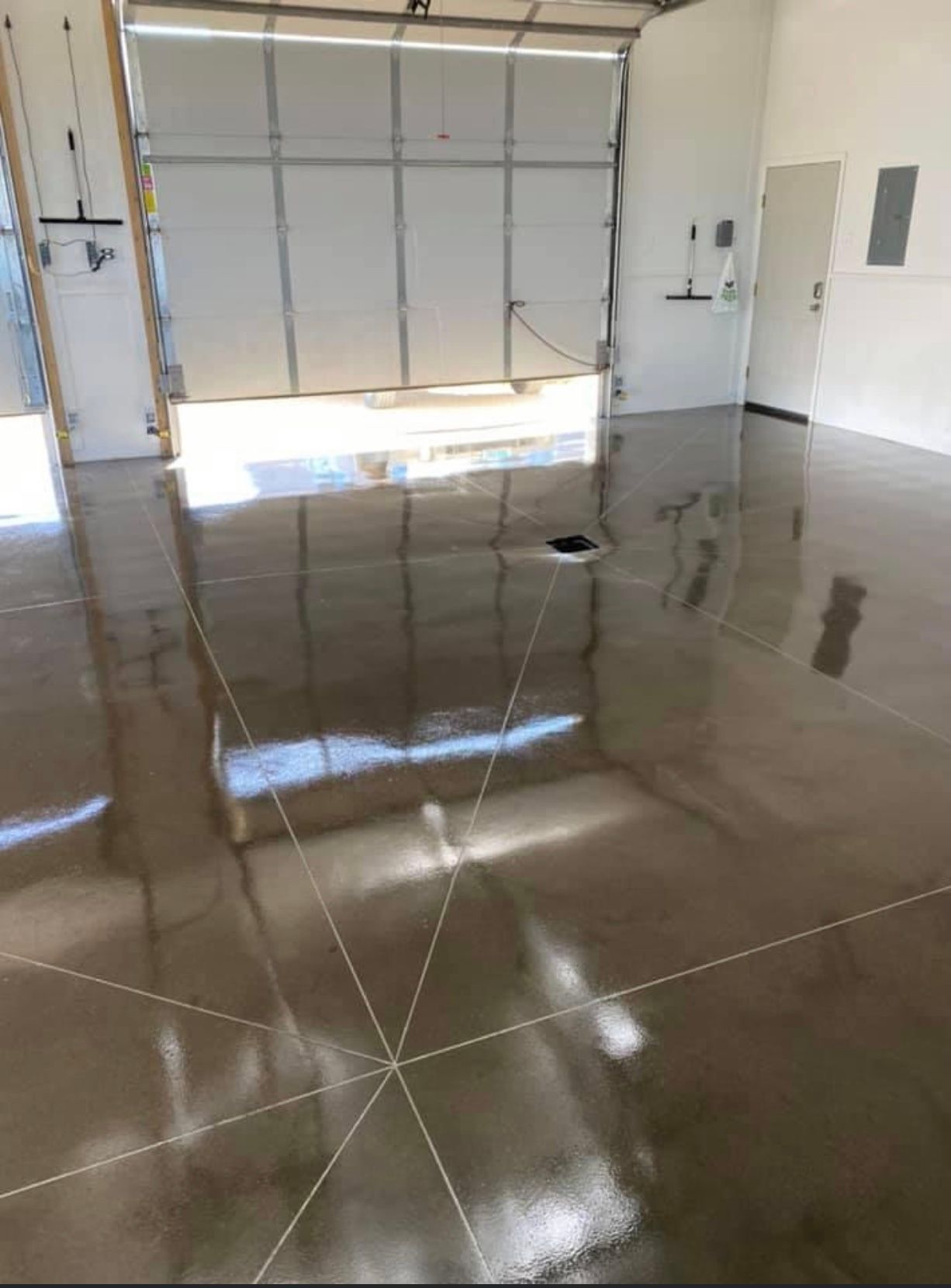 A close up of a shiny metallic floor in a room.
