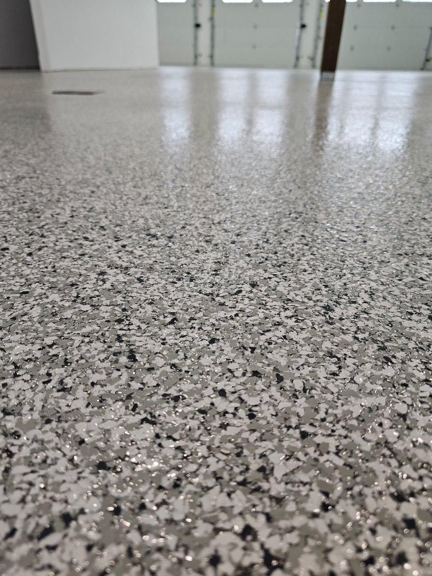 A close up of a concrete floor in a garage.