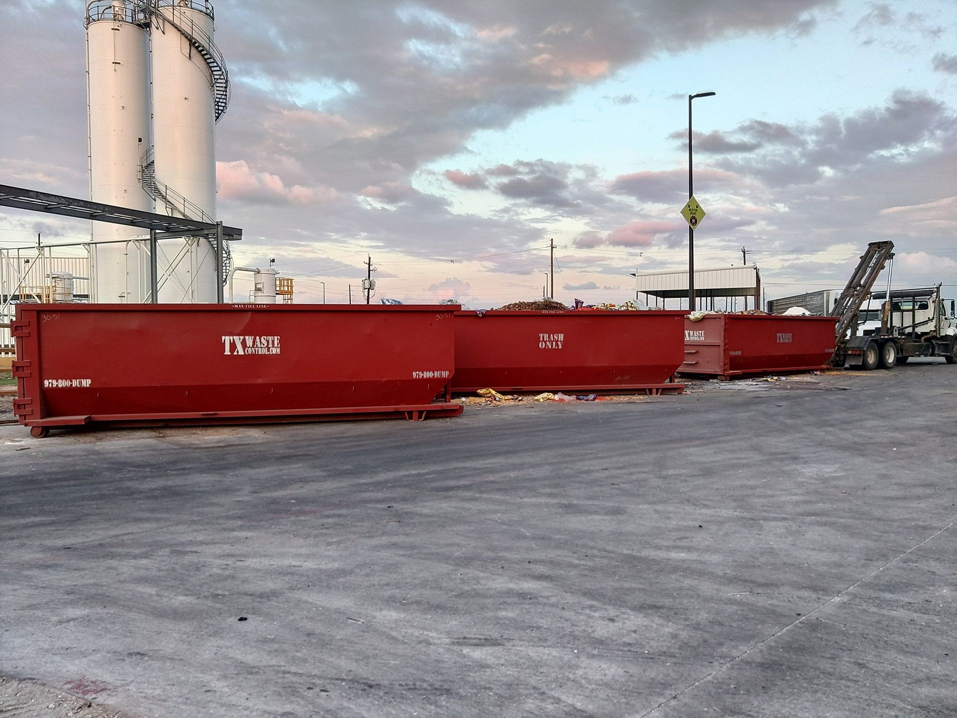 A man is standing on the side of a road.