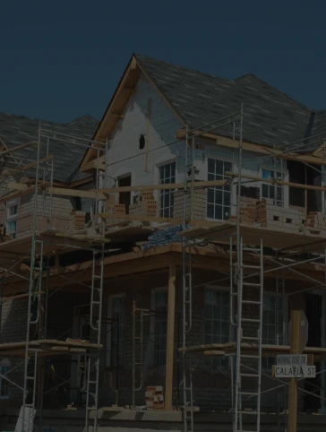 A house is being built with scaffolding around it.