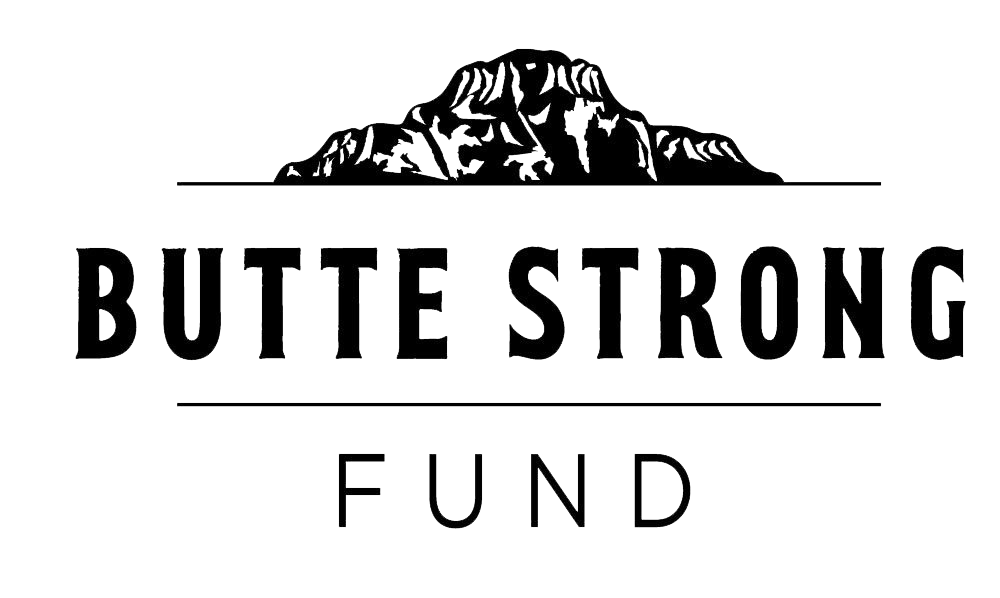 A black and white logo for butte strong fund with a mountain in the background.