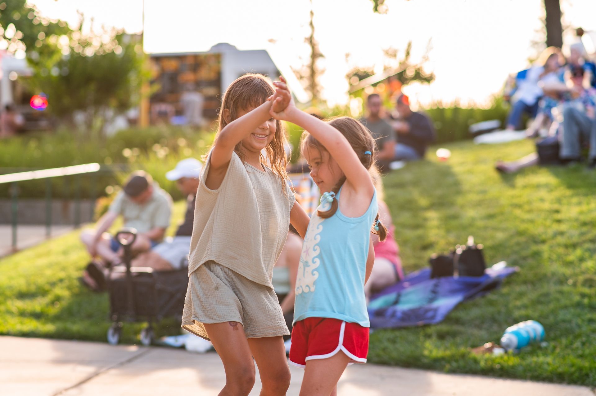 Two friends enjoying conversation at Party in the Park in Paradise California