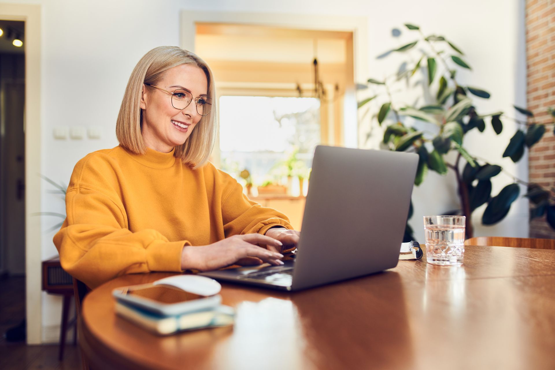 Woman With Eyeglass Using Laptop — Lincoln, NE — Optical Gallery