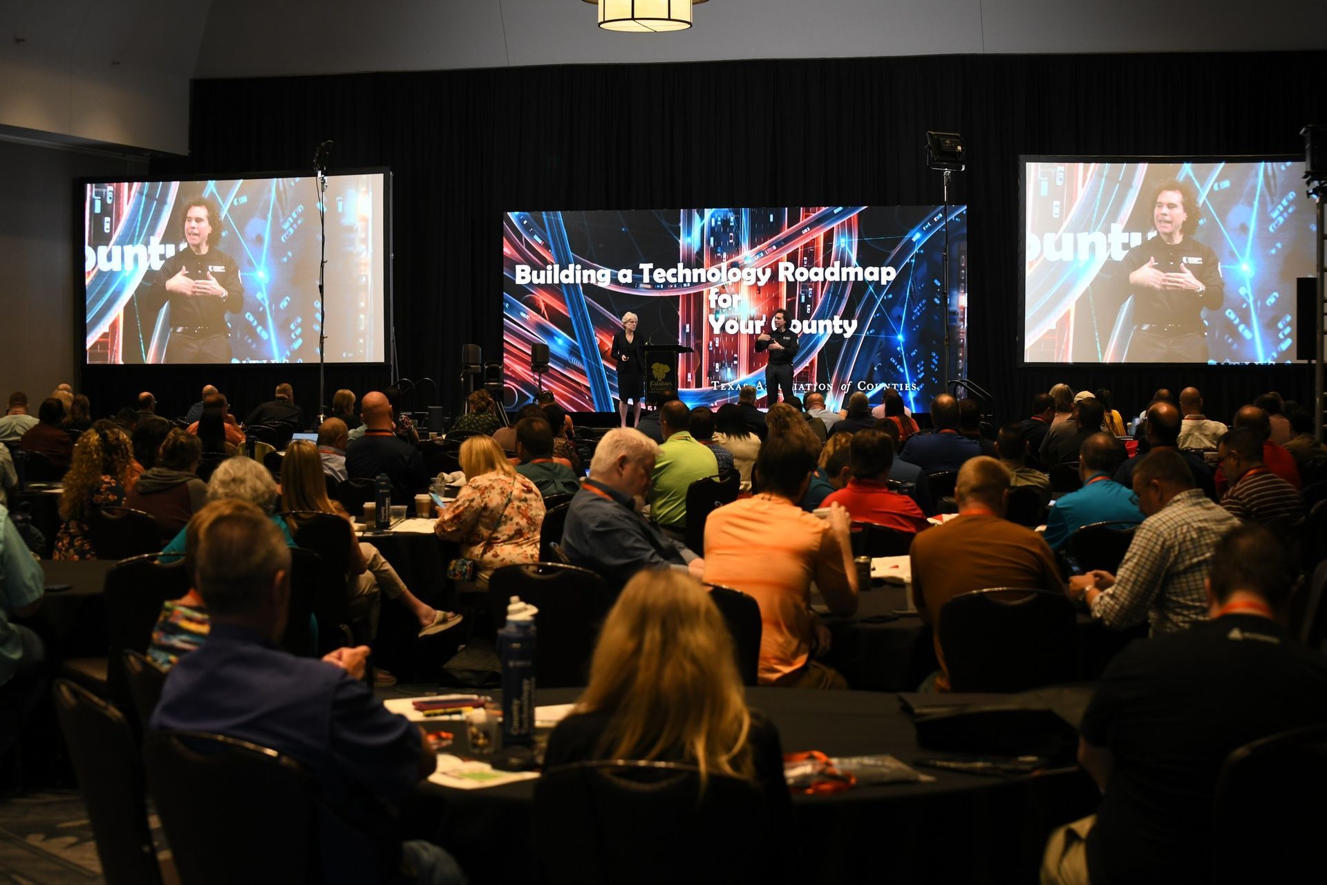 View of conference main session from back of room.