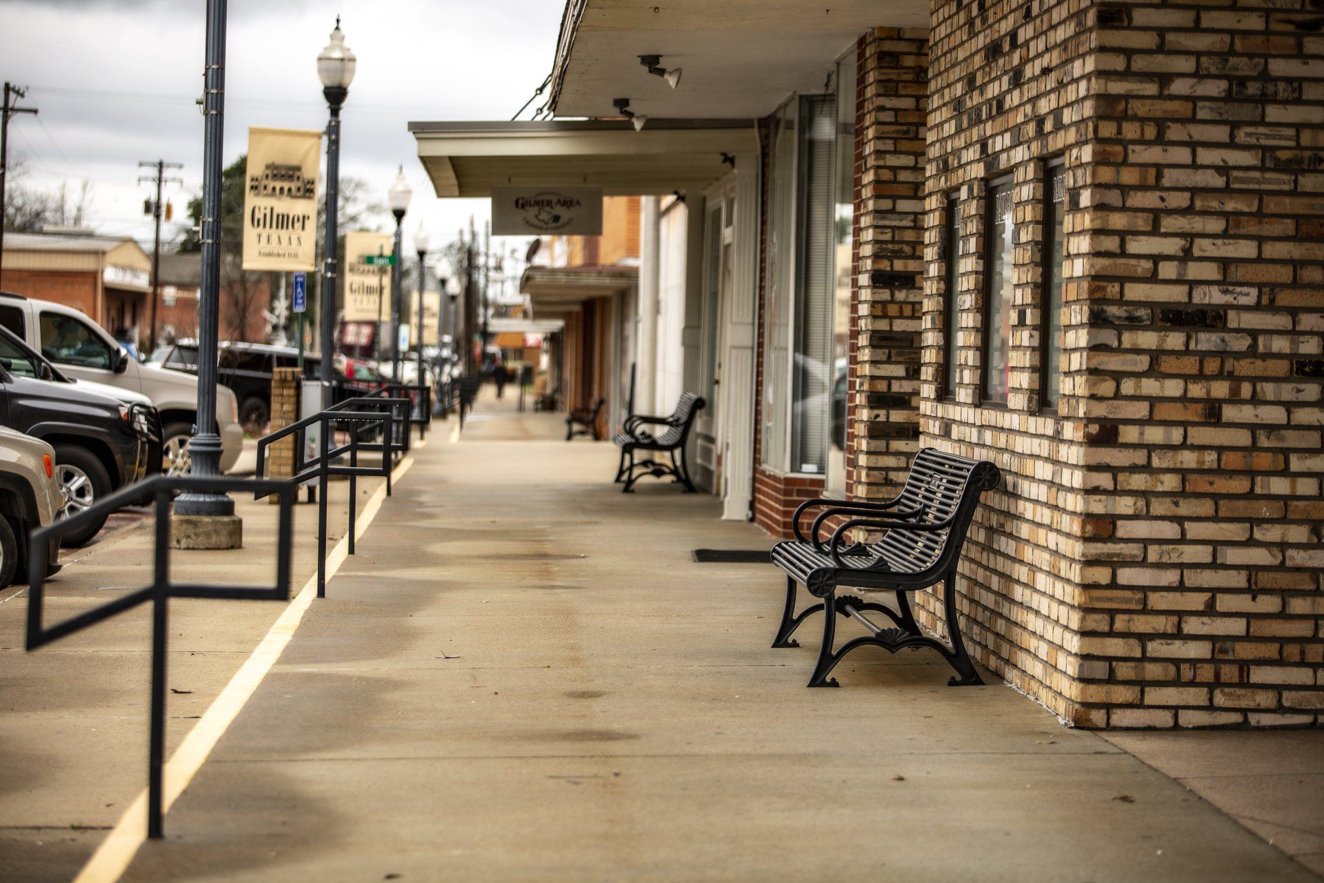 A brick building with a bench in front of it