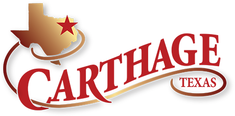 The logo for carthage texas has a texas map and a star on it.