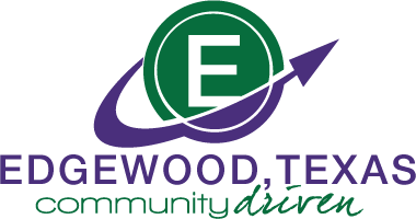The logo for edgewood texas community driven has a green circle with an arrow in it.