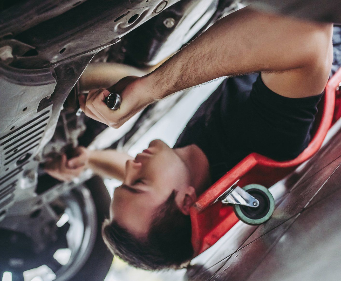 Car Lifted in an Auto Repair Shop — Detroit, MI — CarLine Complete Auto Repair & Collision BBB A+