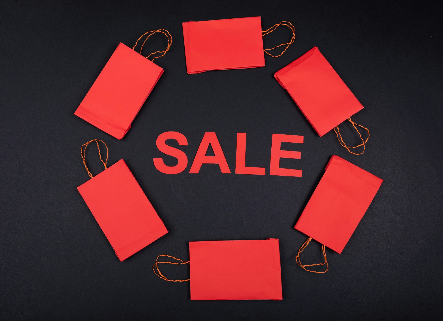 Eight red rectangular price tags with the word 