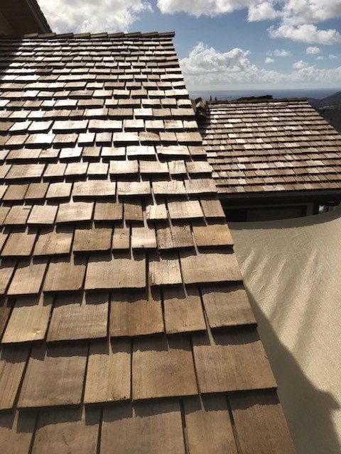 A roof with a lot of wooden tiles on it