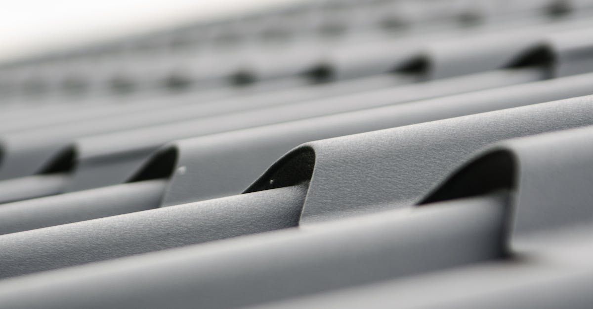 A close up of a roof with a lot of shingles on it.