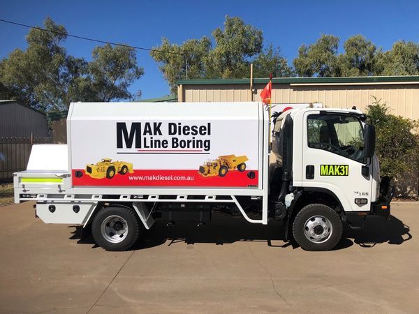 M AK Diesel Line Boring White Truck — Digital Printing in Mount Isa, QLD